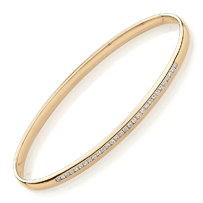 Colorful Bangle Sets-Oval bangle with 0.45 carats* of diamond simulants in 10 carat yellow gold